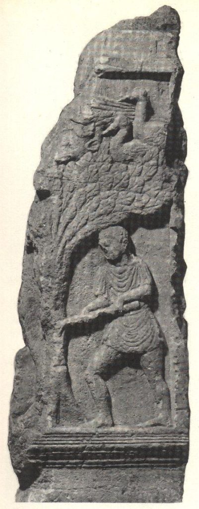 A bearded man works at the base of a tree with a tool, and above his head are cranes and a bull's head in the leaves