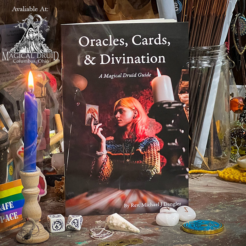 Rev. Dangler's book, "Oracles, Cards, & Divination" on an altar