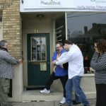 MJD cuts ribbons with Seamus in front of the first Magical Druid storefront