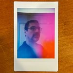 Aura Photo with pinks, oranges, and blues around MJD