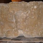 An antlered, bearded head with torcs hanging from the antlers, text "ERNVNNO" at top