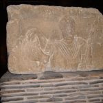 Male figure, carrying a lance, with a horse to his right. CASTOR inscribed above