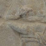 Detail of the hammer held in the right hand