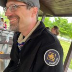 MJD smiles for the camera, a Scouting America "Cubmaster" badge on his shoulder