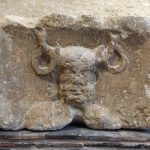 An antlered, bearded head with torcs hanging from the antlers, text "ERNVNNO" at top