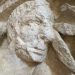 the bearded face of Esus, from an angle