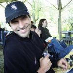MJD in a White Sox hat grins at the camera with a cap gun and silver star in hand