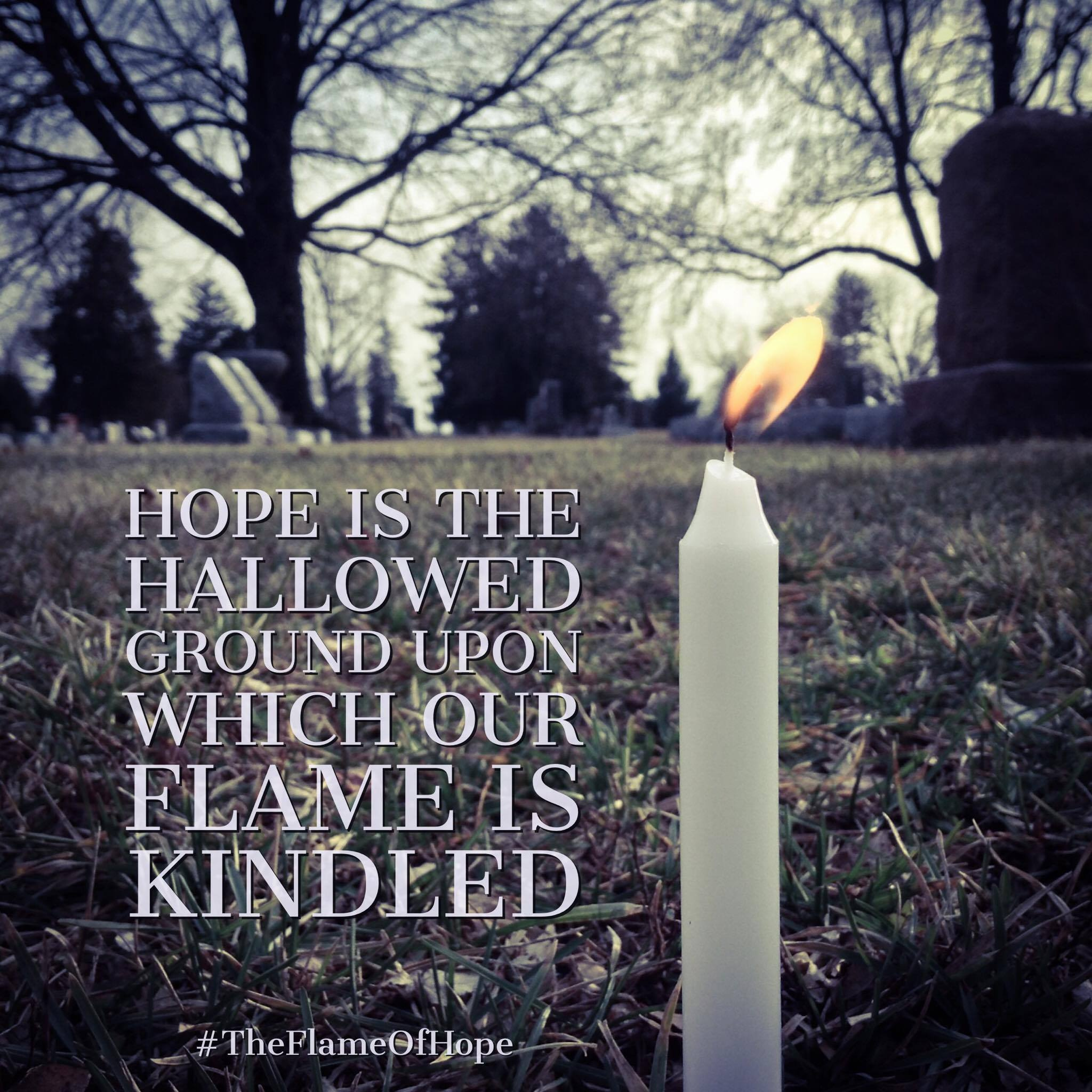 A candle in a cemetery; text: "Hope is the hallowed ground upon which our flame is kindled"